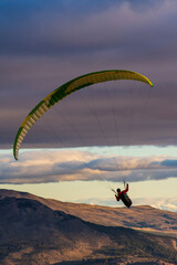 Low angle view of paraglider against sky with clouds in Esquel, Patagonia, Argentina
