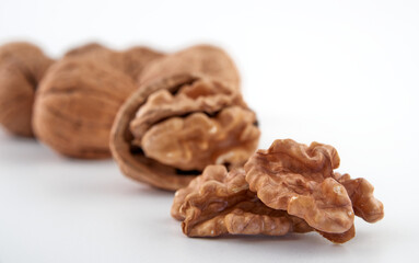 Walnuts in close-up, isolated on a white background.Space for text