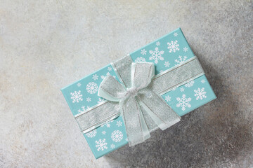 Xmas background. Christmas presents gift blue box. Top view flat lay background.