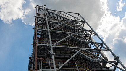 Petrochemical refinery plant. Industrial towers at oil refinery. Oil refinery twilight on classic blue sky background.. Space for text. Design concept.
