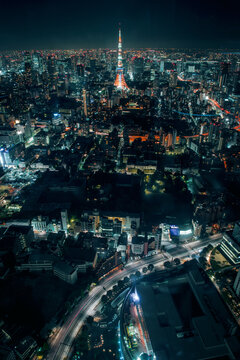 Aerial view of illuminated Tokyo Tower in city