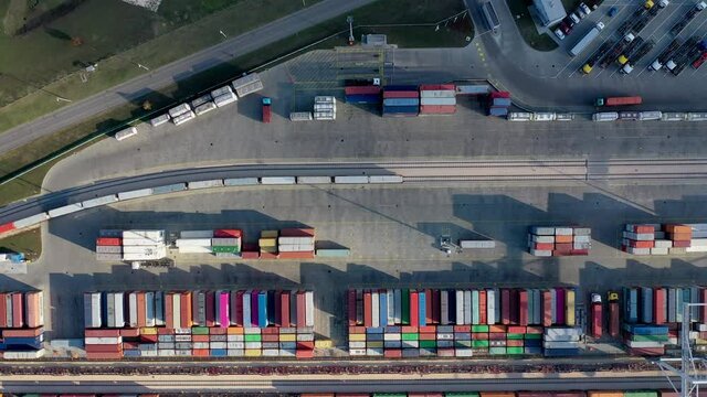 Cargo trains leaving the terminal with containers. Drone view.
