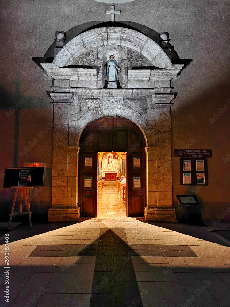 Poster Open door of the church in the night, Sancturary of Our Lady of Laus. South of France. Notre Dame du Laus.