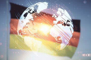 Double exposure of abstract digital world map hologram on flag of Germany and blue sky background,...