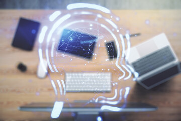 Creative artificial Intelligence concept with human head hologram on modern laptop background....
