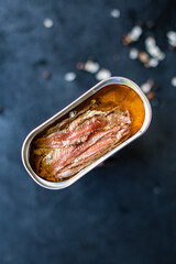 anchovies canned fish in a tin can seafood top view copy space for text food background rustic