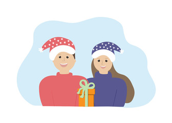 Christmas family holiday. A man and a woman in Christmas hats give gifts.