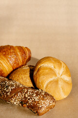 Fresh bakery products. Different buns and croissant background. 