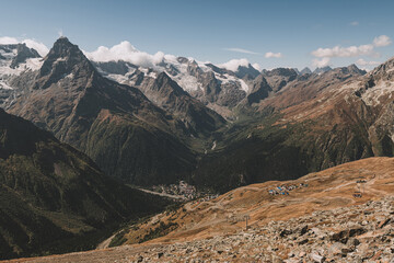 The view from the small village Dombay at mountain top. Hiking and ecotourism in Caucasus mountain. Living in mountain.