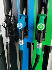 AUCKLAND, NEW ZEALAND - Oct 02, 2020: View of gasoline pump nozzles at Gull petrol station with...