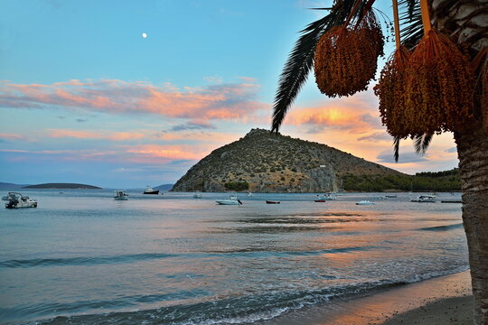 Greece-view of island Romvi at sunset
