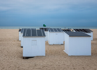 Grey clouds above beach huts in Ostend in Belgium