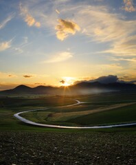 Winding Road In A Rural Valley Of Sicily At The Sunset - 390201681