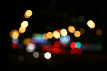 Blur city light of cars headlights on the night city road. Colorful urban abstract background