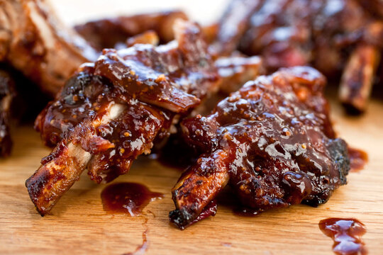 Close up of sweet sour balsamic glazed baby back ribs on table