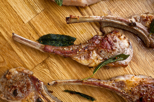 Close up of fried lamb chops with anchovies and capers