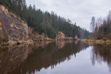 Fototapeta na wymiar City Cesis, Latvia. Rapid river with stones and trees. Natural flora.Travel photo.