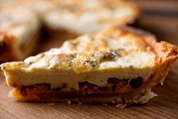 Close up of slice of bacon cheddar quiche