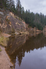 City Cesis, Latvia. Rapid river with stones and trees. Natural flora.Travel photo.