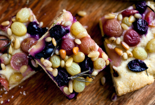 Close up of grape focaccia on wooden table