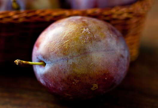 Close up of plum on table