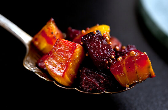 Close up of roasted beets in spoon