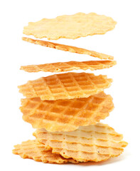 Italian waffles thin and crispy fly on a white background. Isolated levitating wafers