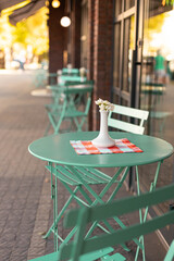 Empty beautiful metal mint tables and chairs at lockdown city street, coronavirus quarantine.Good morning, wake up