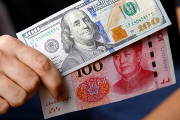 U.S. dollars and Chinese yuan in hand