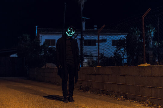 Scary masked man at night