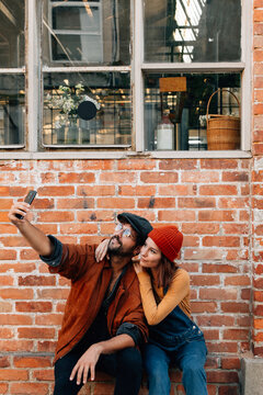 young couple taking a selfie together.