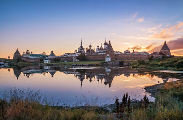 Fototapeta na wymiar A beautiful view of the Solovetsky Monastery with a mirror image