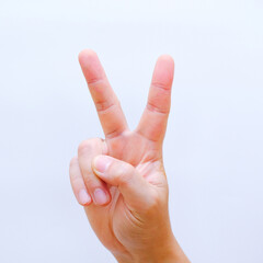 Man's hand shows two fingers up isolated on white background. Finger symbols of peace strength fight, victory symbol, letter V in sign language, number two or second, Clipping Path, victory and peace