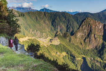 July 2018. Machu Picchu, Cusco. Peru. 
Locals starting their day with the sunrise at one of the Modern Wonders of the world.