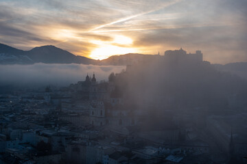 Fototapeta premium sunrise over the mountains in salzburg city - christmas morning sunrise