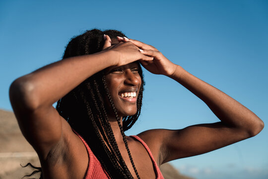 Happy black woman on the beach