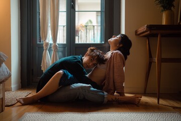 lesbian couple feeling their love at home.