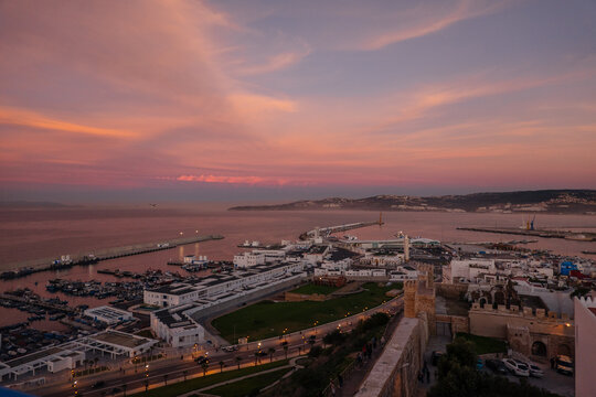 City ??with towers and houses on coast under wonderful sky