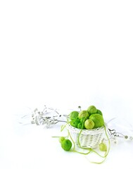 Green balls of yarn for hand knitting.