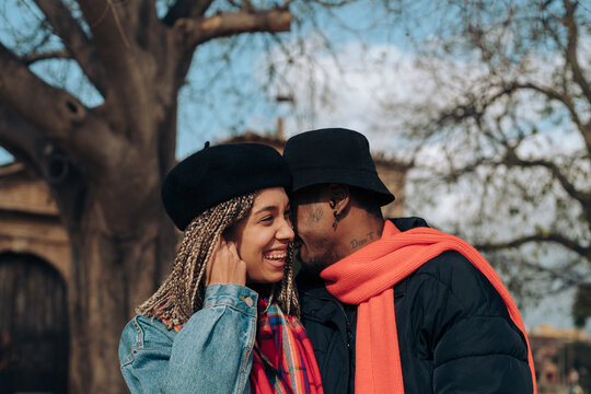 Multiracial couple laughing