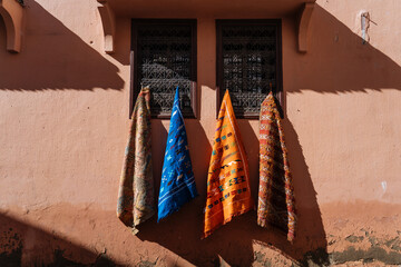 Bright cloths hanging on window guard