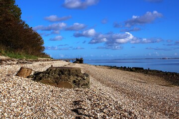 Pebble riverbank and clouds
