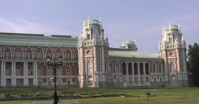 4K high quality sunny spring day video footage of famous Moscow Tsaritsyno Estate built during rein of Czarina Katherine 2 The Great with visitors and panorama of green park in the capital of Russia