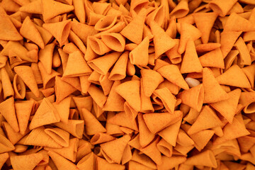 Triangle orange corn chips abstract background texture