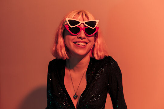 Young woman in orange light