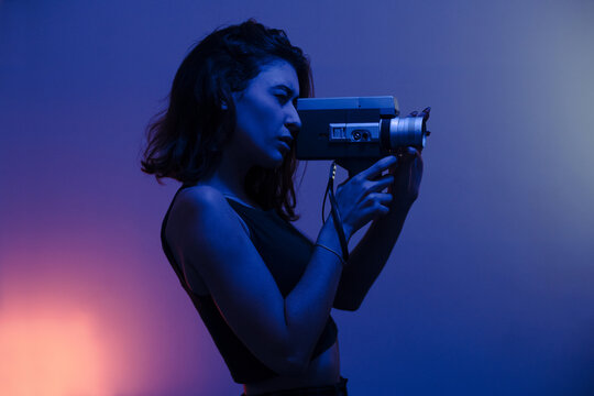 Woman filming with a Super 8mm camera