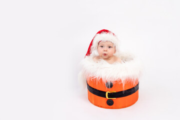 child on white background in Santa costume, new year and Christmas concept, place for text