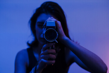 Woman filming with a Super 8mm camera