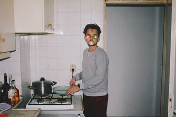 Strange person in kitchen