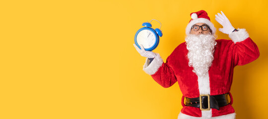 santa claus isolated on background with clock or alarm clock